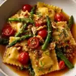 Ravioli With Tomatoes Asparagus Garlic And Herbs Recipe